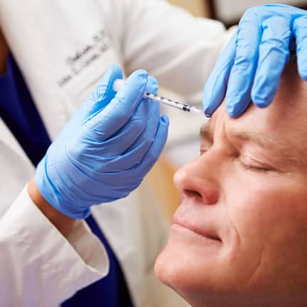 botox on male model's forehead