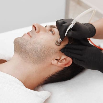 microderm treatment on client's face