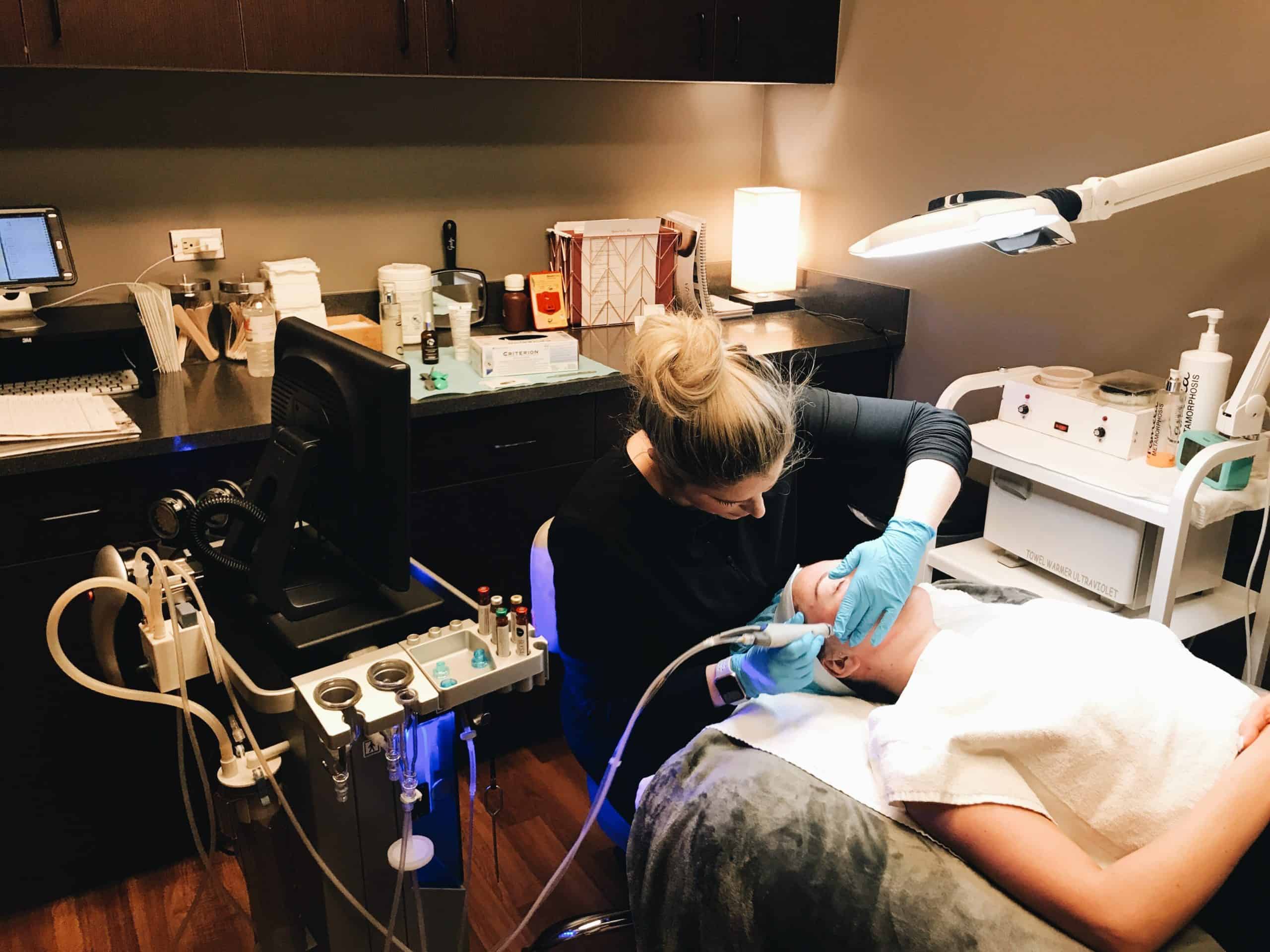 facial treatment on client