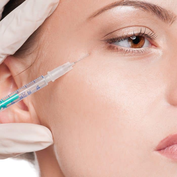 model getting botox around eye