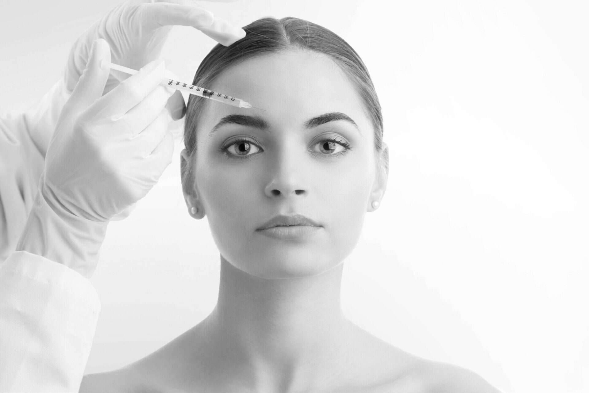 model getting preventative botox on forehead