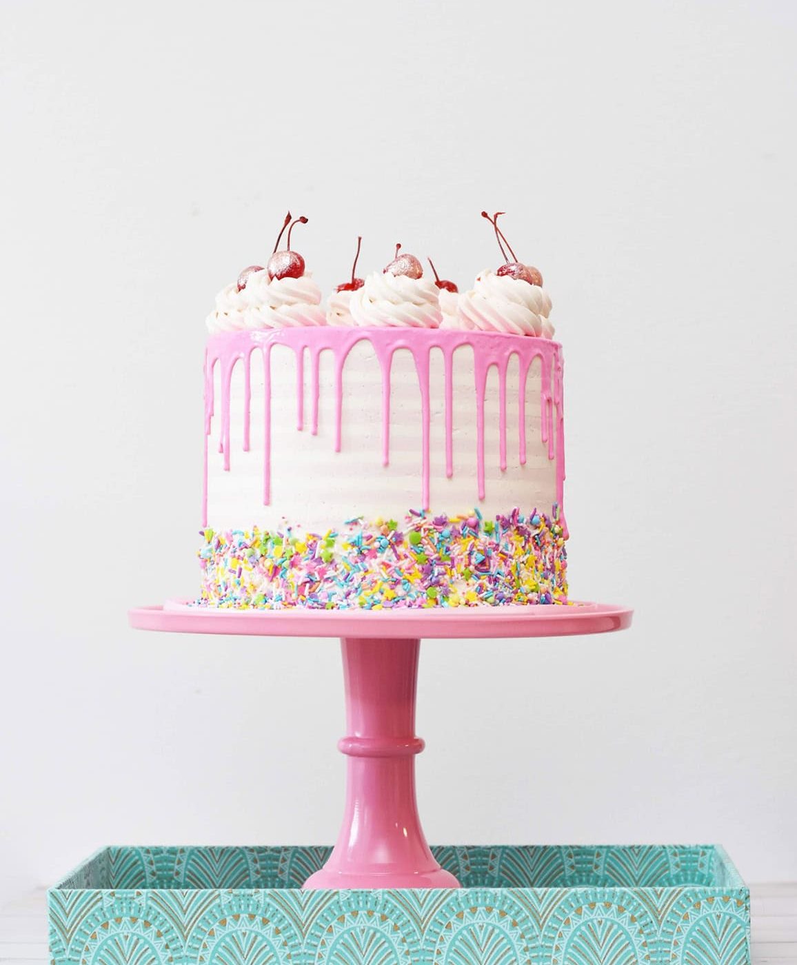 pink and white birthday cake
